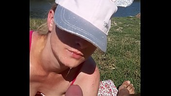 His wife sucks his dick while on the beach to tan his skin. The wife was scared because she was in public and she was scared not to be seen by others.